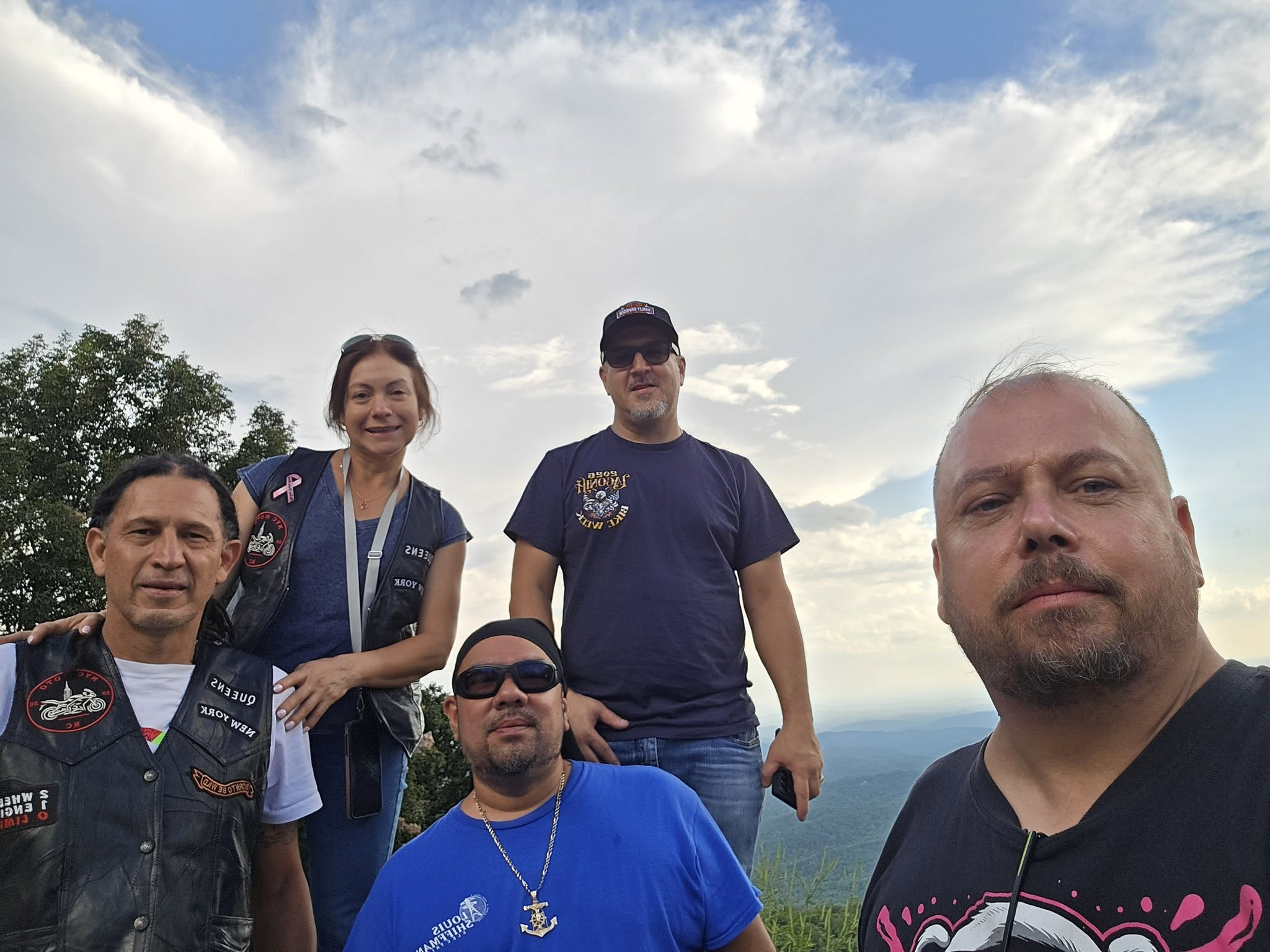 Riders together at a mountain overlook